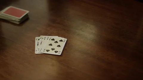 Playing cards at the table, hands with playing cards, close-up Stock Footage 230950522
