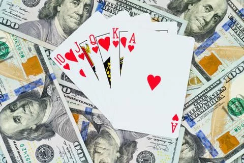 Playing cards on US dollars background. Macro. Stock Illustration