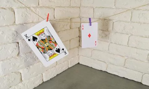 Playing cards on wall background Stock Photos