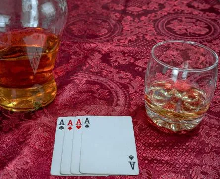 Playing cards with which he scotch whiskey with a bottl Stock Photos