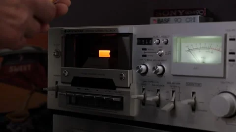Playing cassette on deck. Stockbeeldmateriaal 160216248