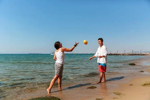 Playing catch on the beach Stock Photos
