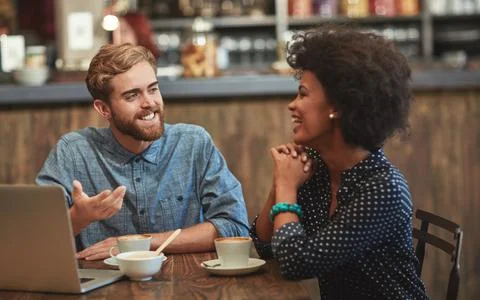 Playing catch up over coffee. a young couple enjoying a coffee date. Fotos Stock