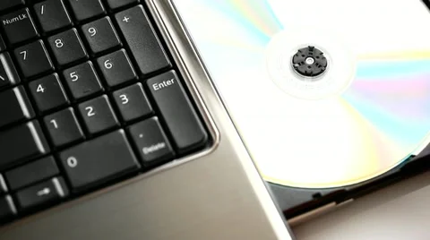 Playing a CD / DVD/  Disk installation Video stock 10832687