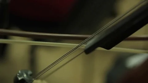 Playing the cello with a bow - stringed musical instrument. Stock Footage 72648830