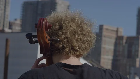 Playing cello in the middle of city Stock Footage 111045422