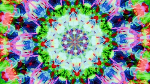 Playing centered kaleidoscopic mandala morphing on screen, brightening core and Stock Footage 337886046