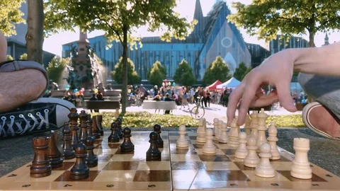 Playing chess on the lawn against the background of Augustusplatz Leipzig Video stock 81097517