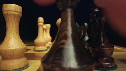 Playing chess while camera is moving between pieces on chessboard macro Stock Footage 149379247