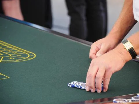 Playing with chips at a roulette table Foto stock