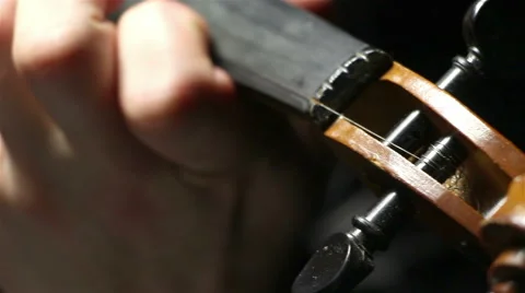 Playing chords on a broken violin Stockbeeldmateriaal 59024946