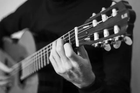 Playing classical guitar close-up, black &amp; white Stock Photos