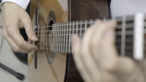 Playing classical guitar. Slow motion Stock Footage 115335320
