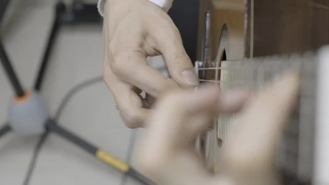Playing classical guitar. Slow motion Stock Footage 128093049