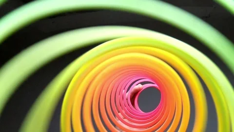 Playing with a colored Slinky Stock Footage 277875646