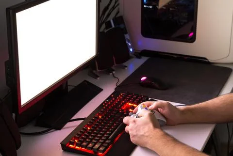 Playing computer game with gaming gear. Stock Photos