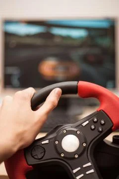 Playing computer games with computer wheele Stock Photos