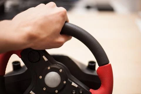 Playing computer games with computer wheele Stock Photos