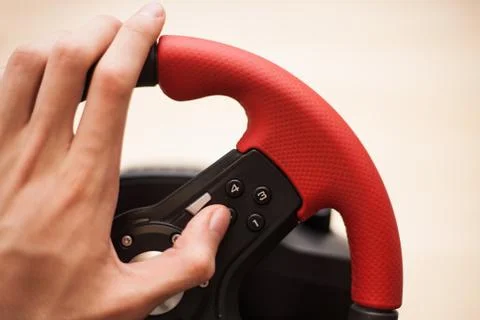 Playing computer games with computer wheele Stock Photos