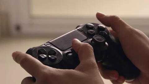 Playing Console Videogame with Gamepad Stock Footage 198868998