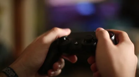 Playing Console Videos Games with Controller Stock Footage 65004368