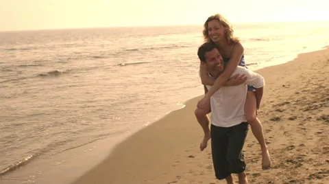 Playing couple on beach. Stock Footage 43656350