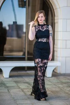 Playing coy in front of reflective window. Stock Photos