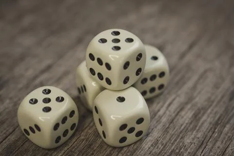 Playing cubes on a wooden table Stock Photos