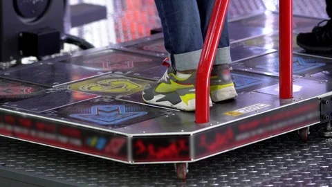 Playing on Dance Dance Reovolution in close-up Video stock 118890730
