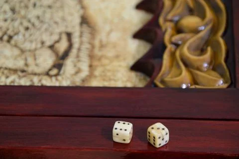 Playing dice on a game board 写真素材