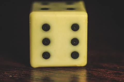 Playing dice on a table with beautiful backlight Фото