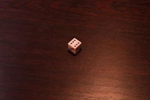 Playing dice on a table with beautiful backlight 스톡 사진