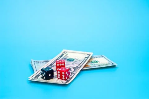 Playing Dices and Stack of American Dollars Bills 스톡 사진