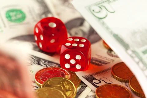 Playing Dices and Stack of American Dollars Bills. 스톡 사진