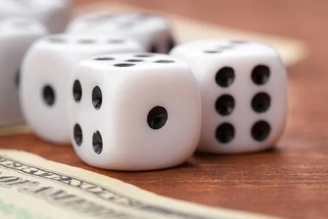 Playing Dices and Stack of American Dollars Bills. Stock Photos
