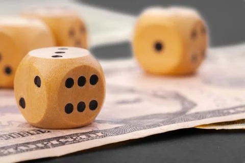 Playing Dices and Stack of American Dollars Bills. Foto stock