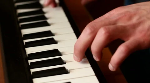 Playing the Digital Keyboard Stock Footage 49060561