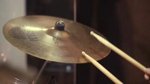 Playing with drum sticks on a drum kit. The musician plays the drums, hitting Stock Footage 144921760