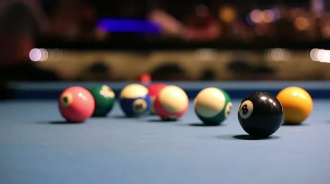 Playing Eight-ball pool billiards in a bar Stock Footage 58453068