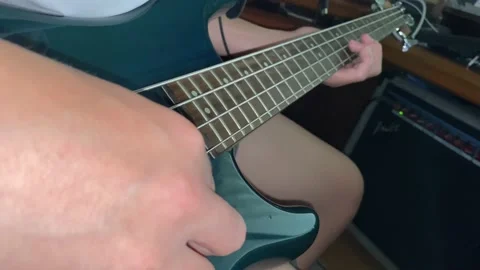 Playing an electric guitar Stock Footage 202193165