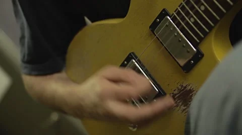 Playing Electric Guitar in the Recording Studio Stock Footage 68630635