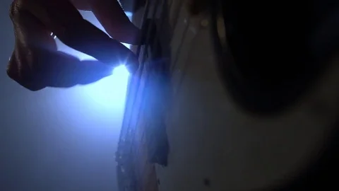 Playing electrical guitar. Man playing bass guitar at a jazz concert. Bass Видео 77570061
