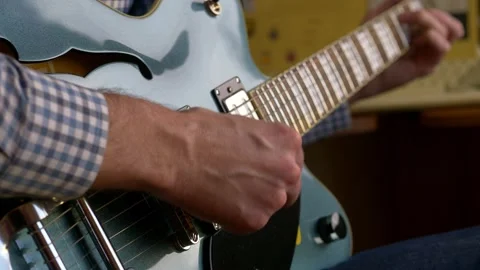 Playing electro guitar, close up of make hands playing electro guitar at home Video stock 149257851