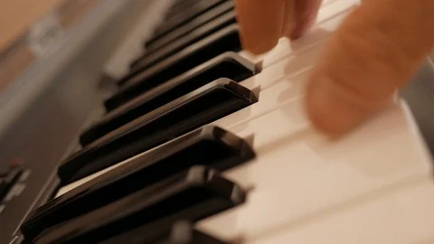 Playing an electronic organ. Stock Footage 124864072