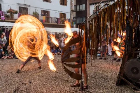 Playing with fire making circles at the medieval fair Stock Photos