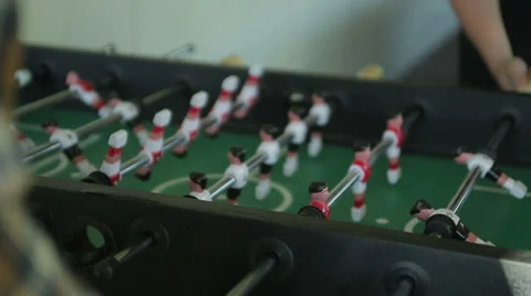 Playing foosball. steadicam shot Stock Footage 54440976