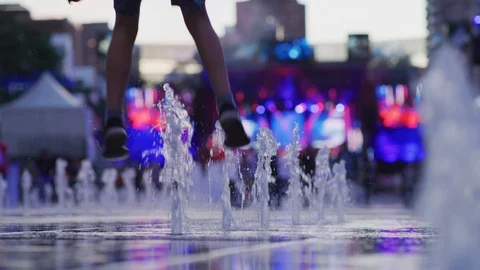Playing at a fountain Stock Footage 99919296