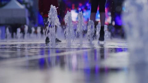 Playing at a fountain Stock Footage 99919310