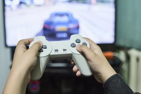 Playing game on console Stock Photos