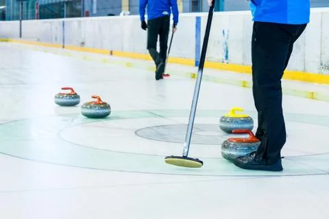Playing a game of curling Stock Photos